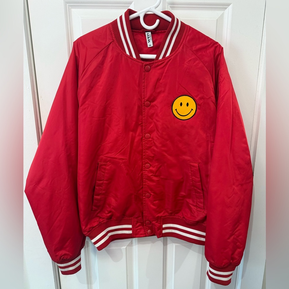 Dressed in Lala Red Jacket with Smiley Patch